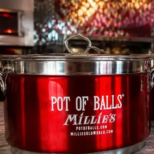 A red Pot of Balls pot with Millie's branding